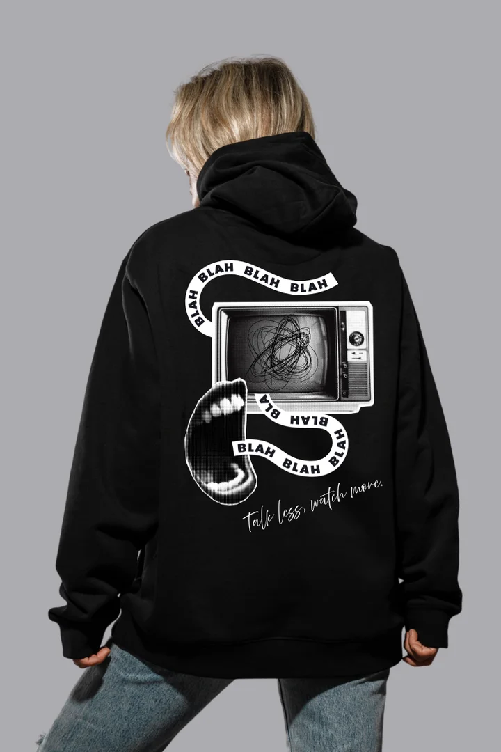 Front view of Talk Less, Watch More” Oversized Women’s Graphic Hoodie – Streetwear Black Pullover